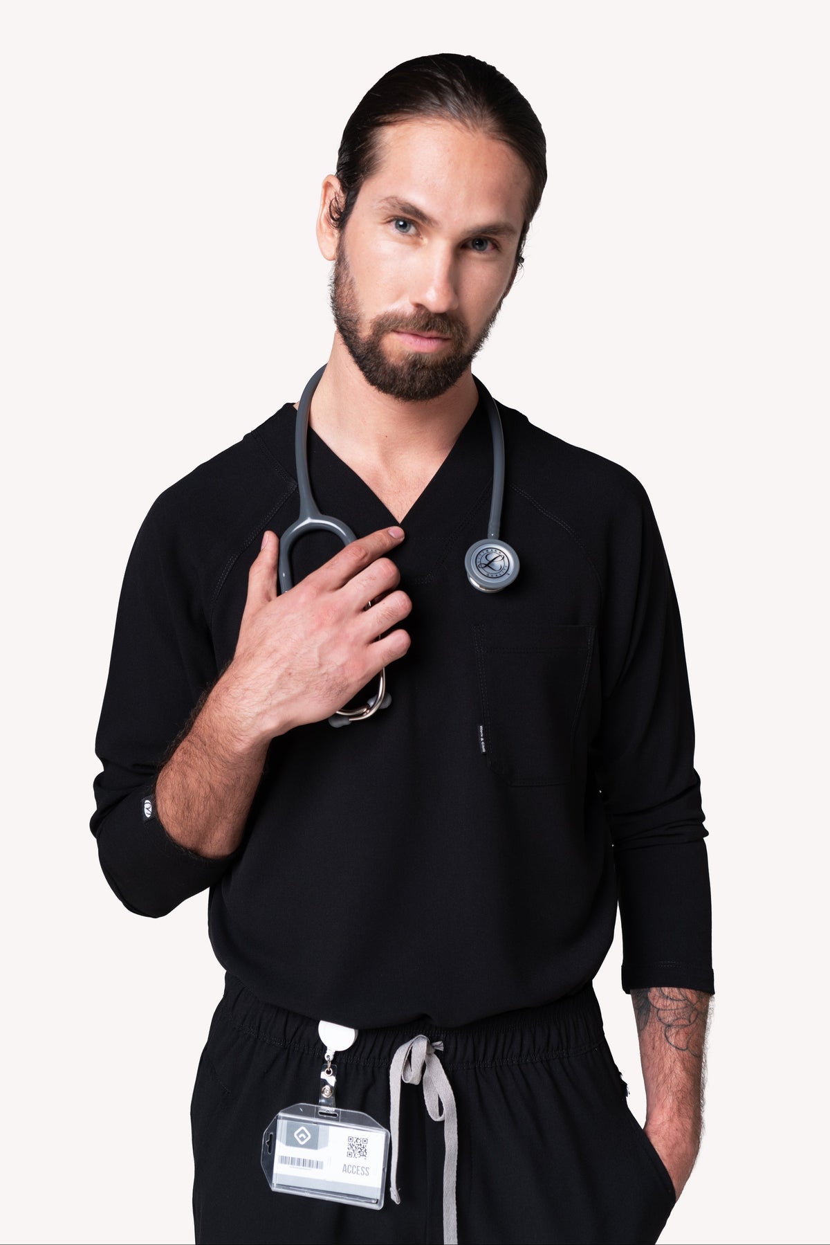 Man wearing Classic Black Scrub Top by Work & Chill