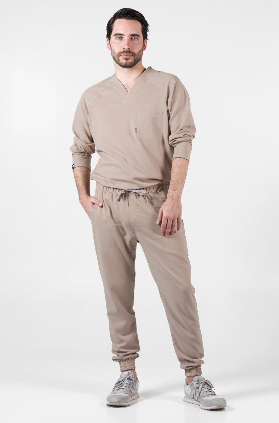 Model wearing Classic Natural Scrub Top with matching natural scrub pants