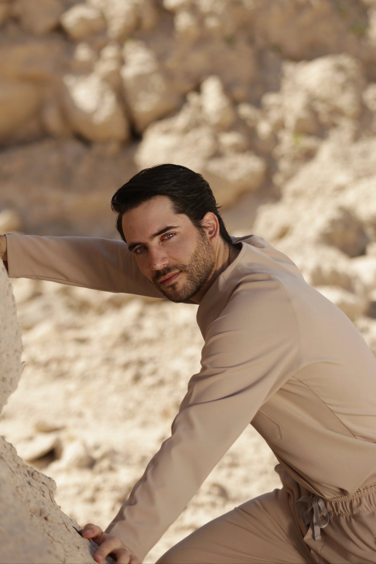 Man wearing Classic Natural Scrub Top in an outdoor lifestyle setting