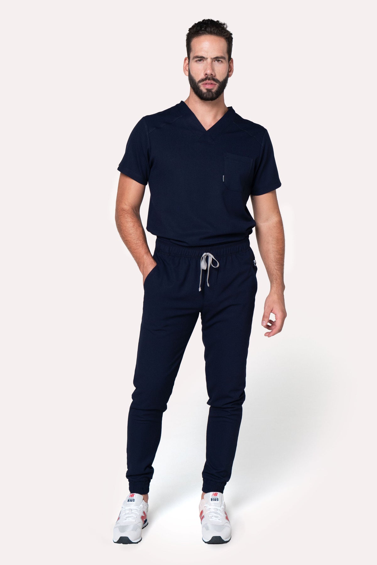 Model wearing Fresh Navy Scrub Pants with matching Fresh Scrub Top