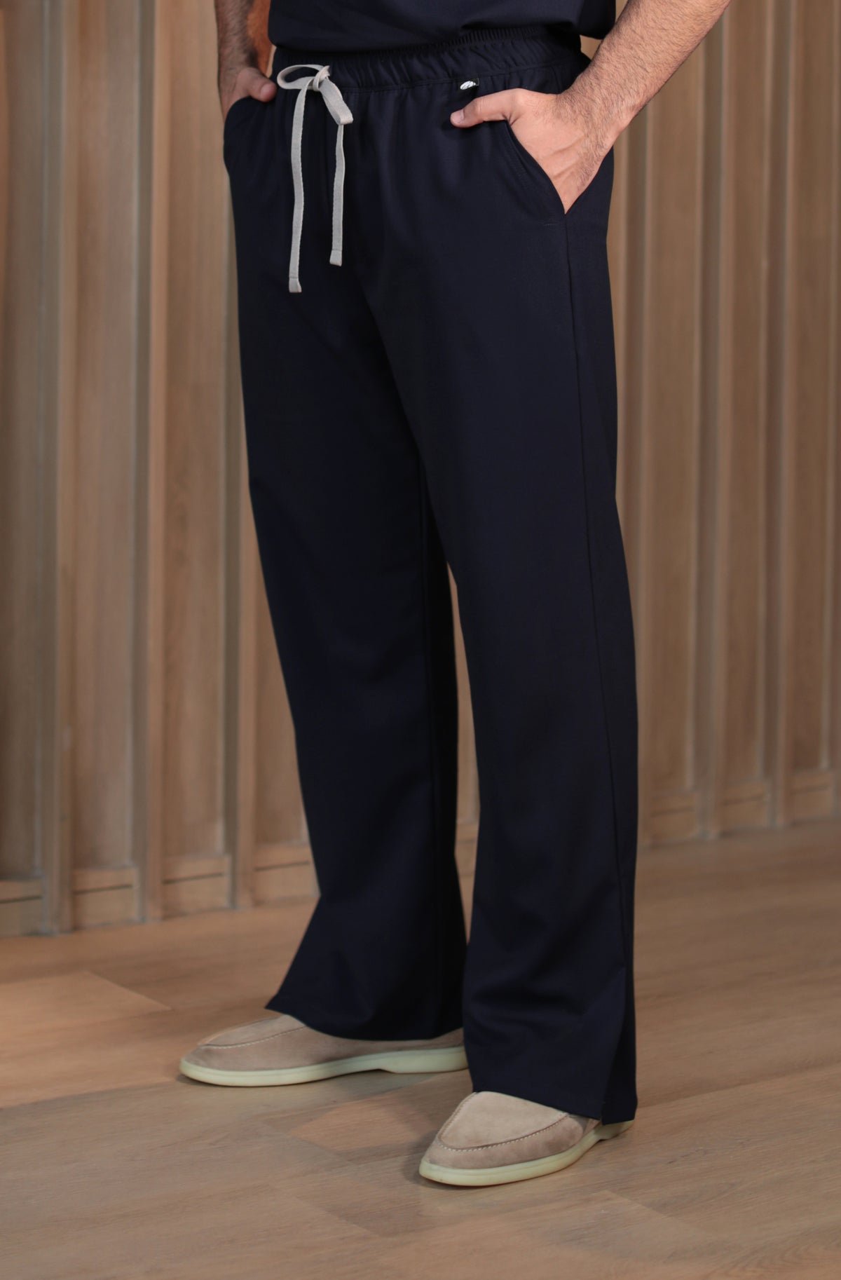 Man wearing Harry Navy Scrub Pants by Work & Chill