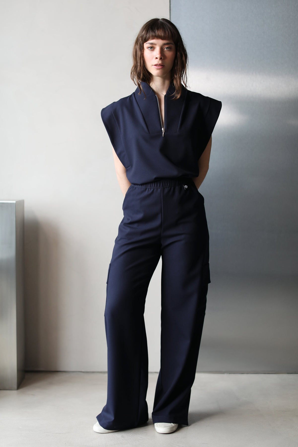 Front view of Kate Navy Scrub Pants styled with matching scrub top