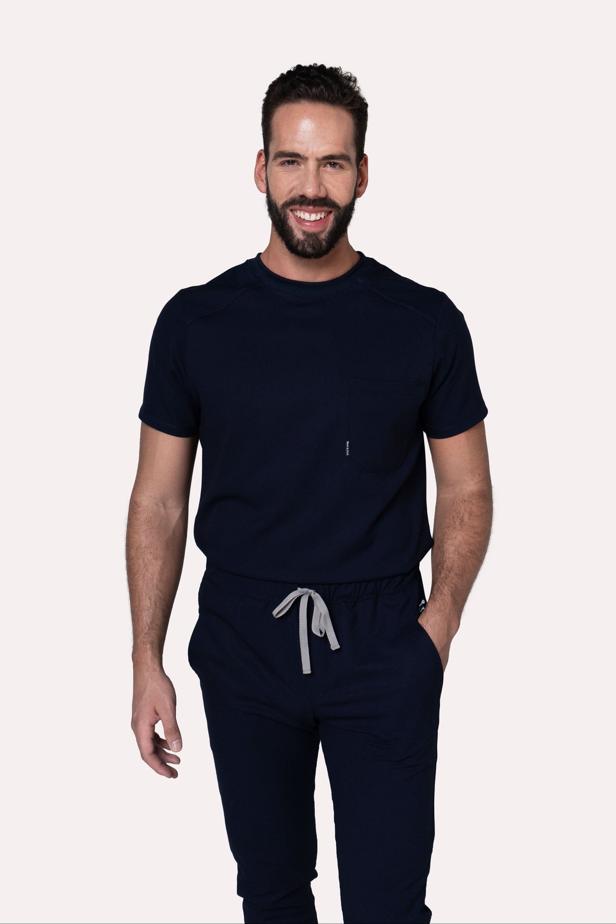 Man wearing Sport Navy Scrub Top by Work & Chill