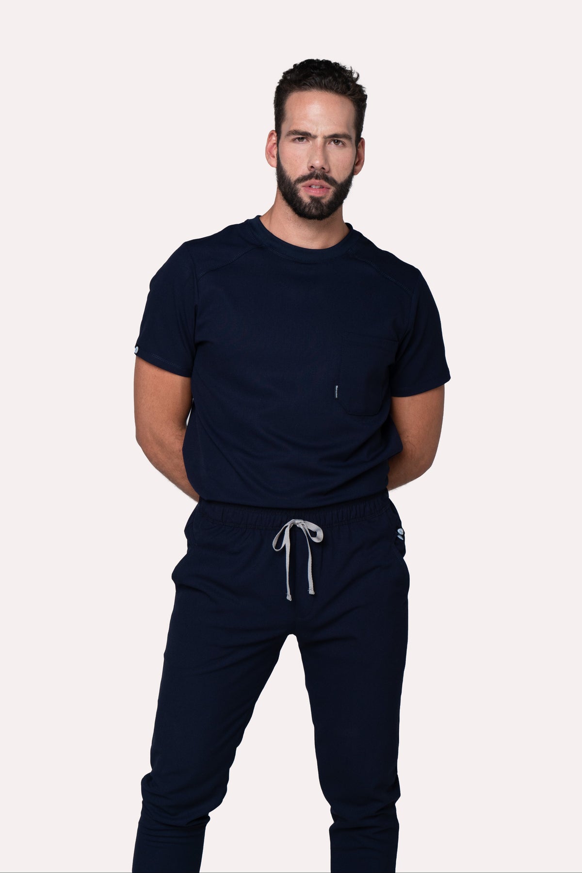 Front view of Sport Navy Scrub Top showing the athletic fit and crew neckline