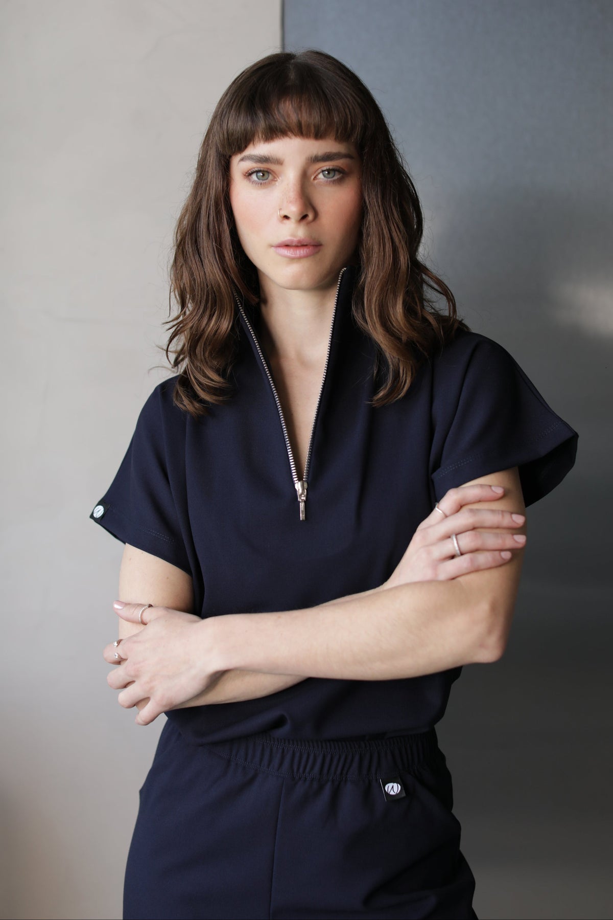 Front view of Victory Navy Scrub Top showing its relaxed silhouette