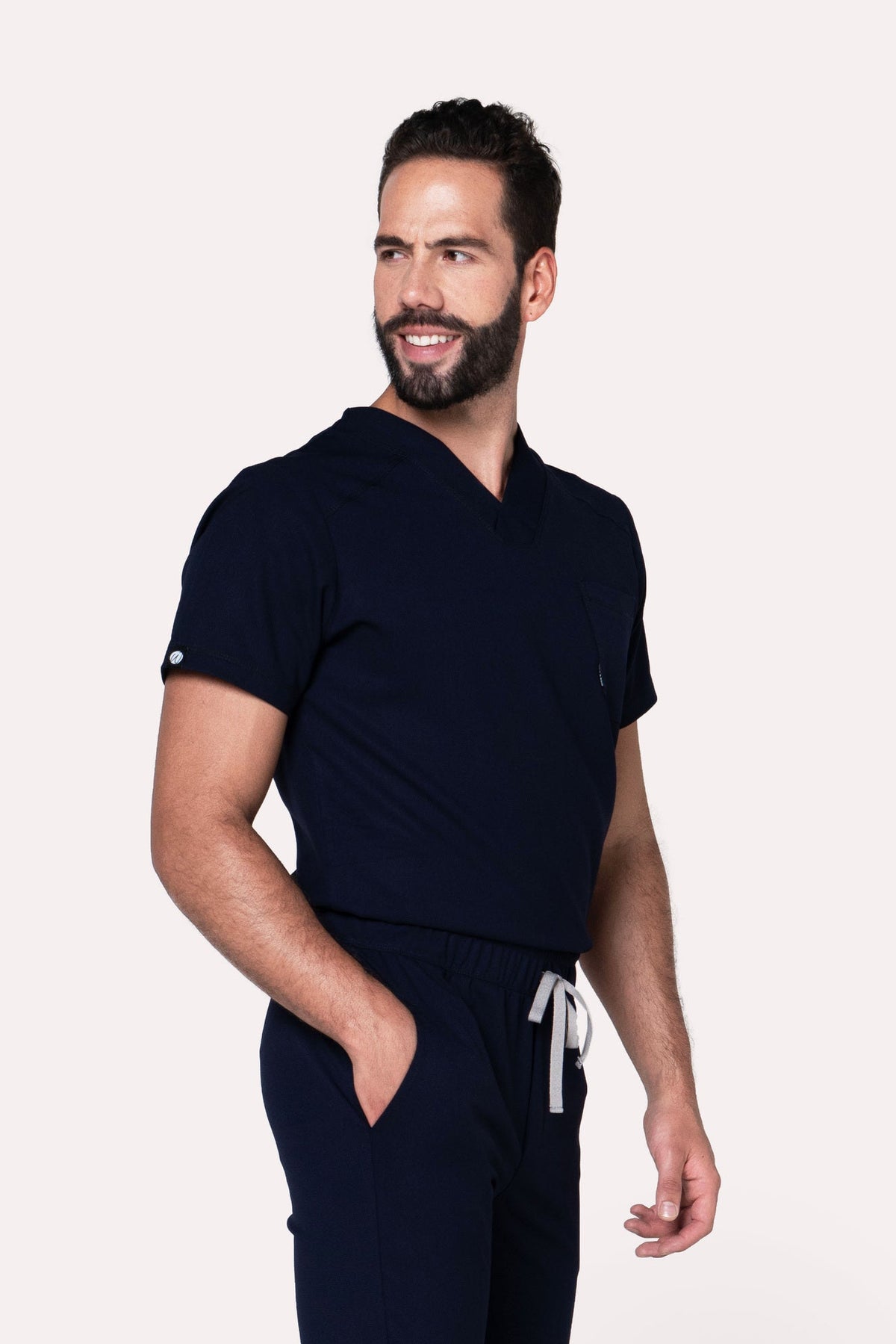Three-quarter view of Fresh Navy Scrub Top showing the relaxed fit