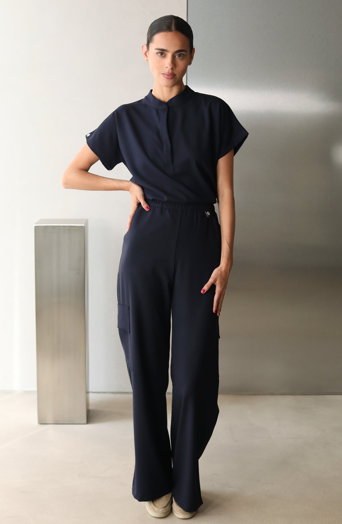 Glam Navy Scrub Top styled with matching scrub pants