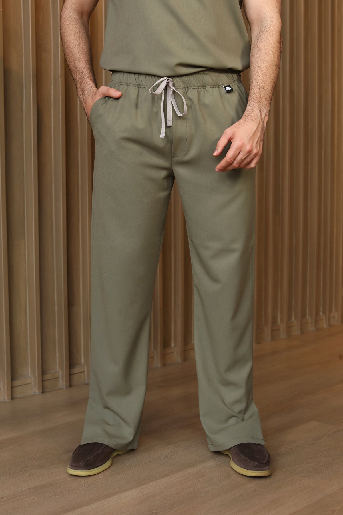 Man wearing Harry Olive Scrub Pants by Work & Chill