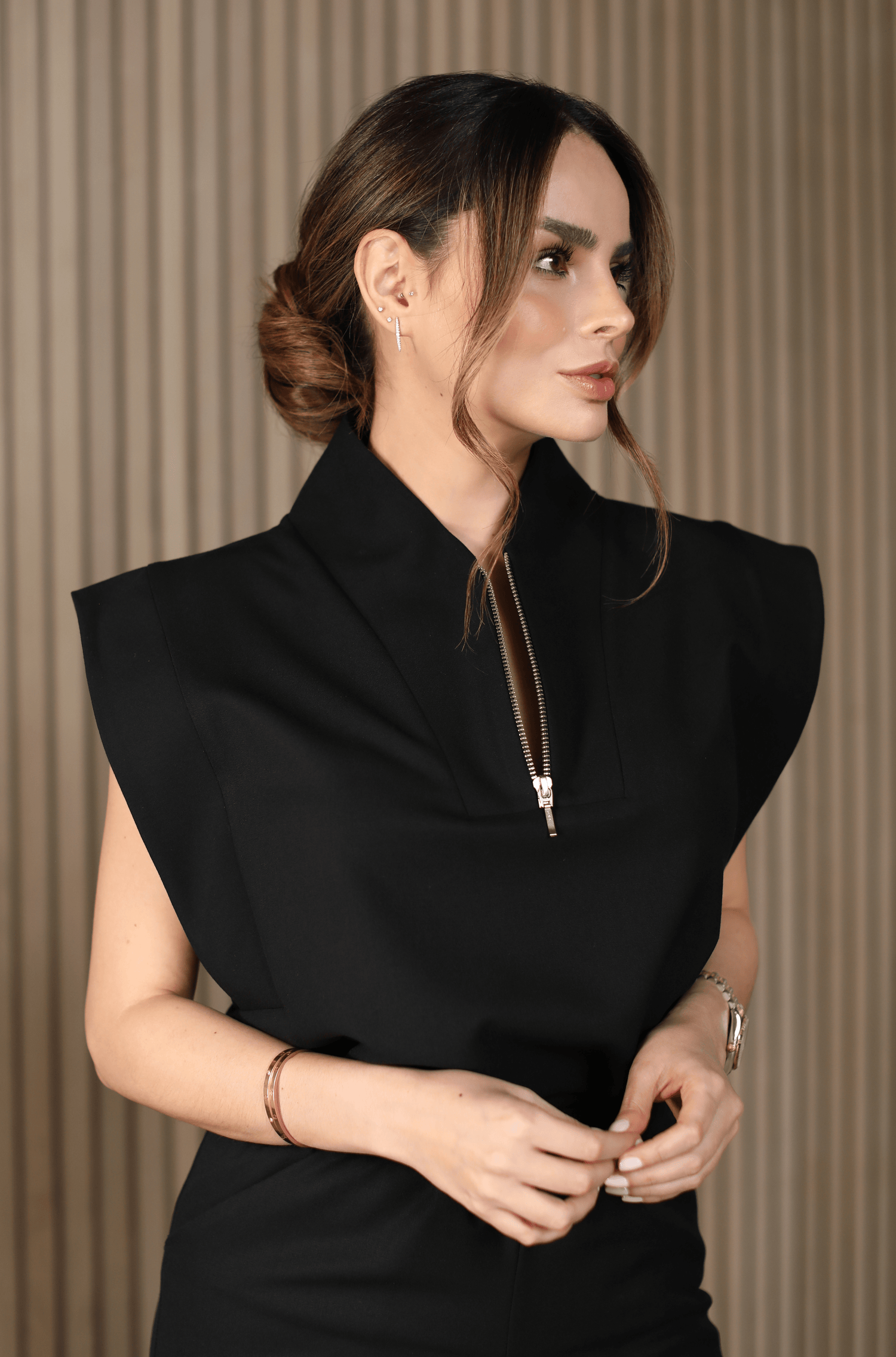 Woman wearing Kate Black Scrub Top by Work & Chill