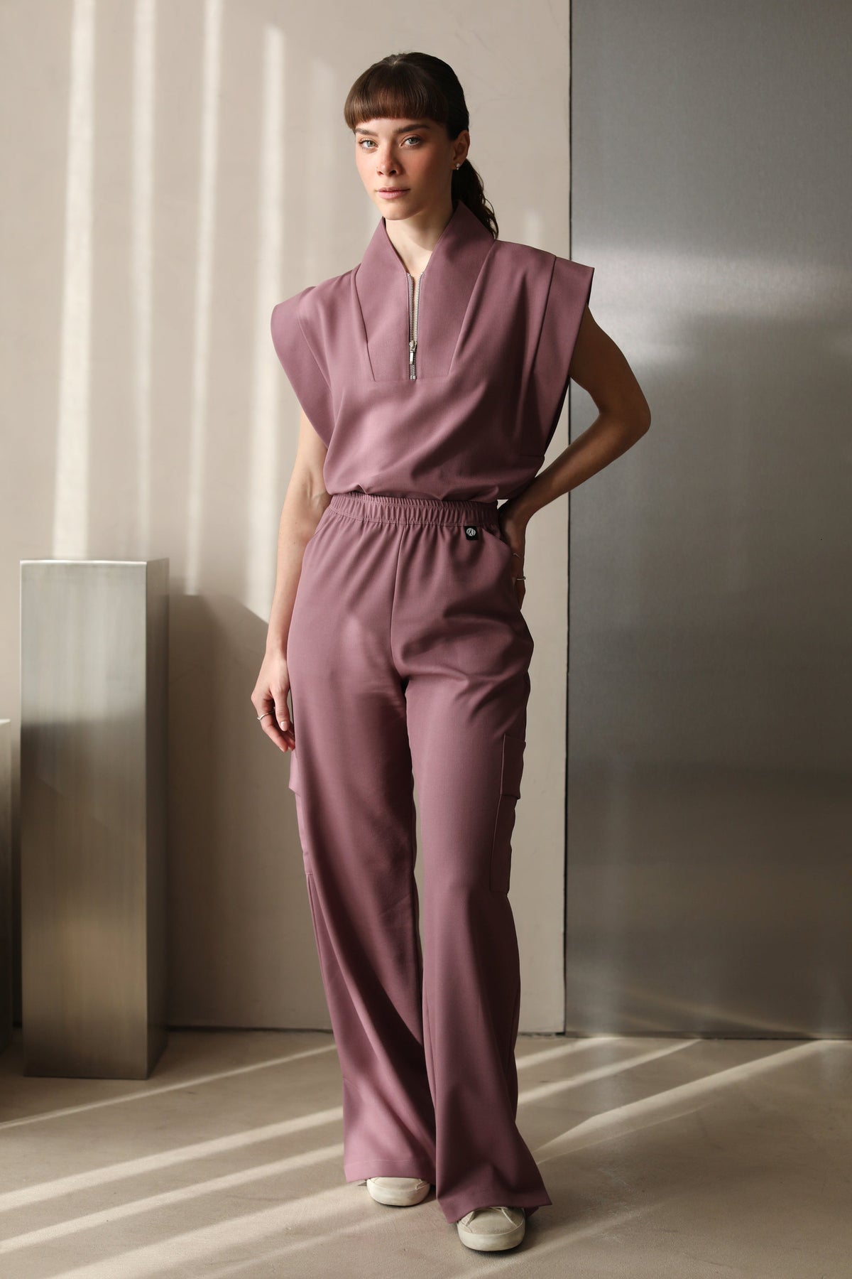 Woman wearing Kate Mauve Scrub Pants by Work & Chill