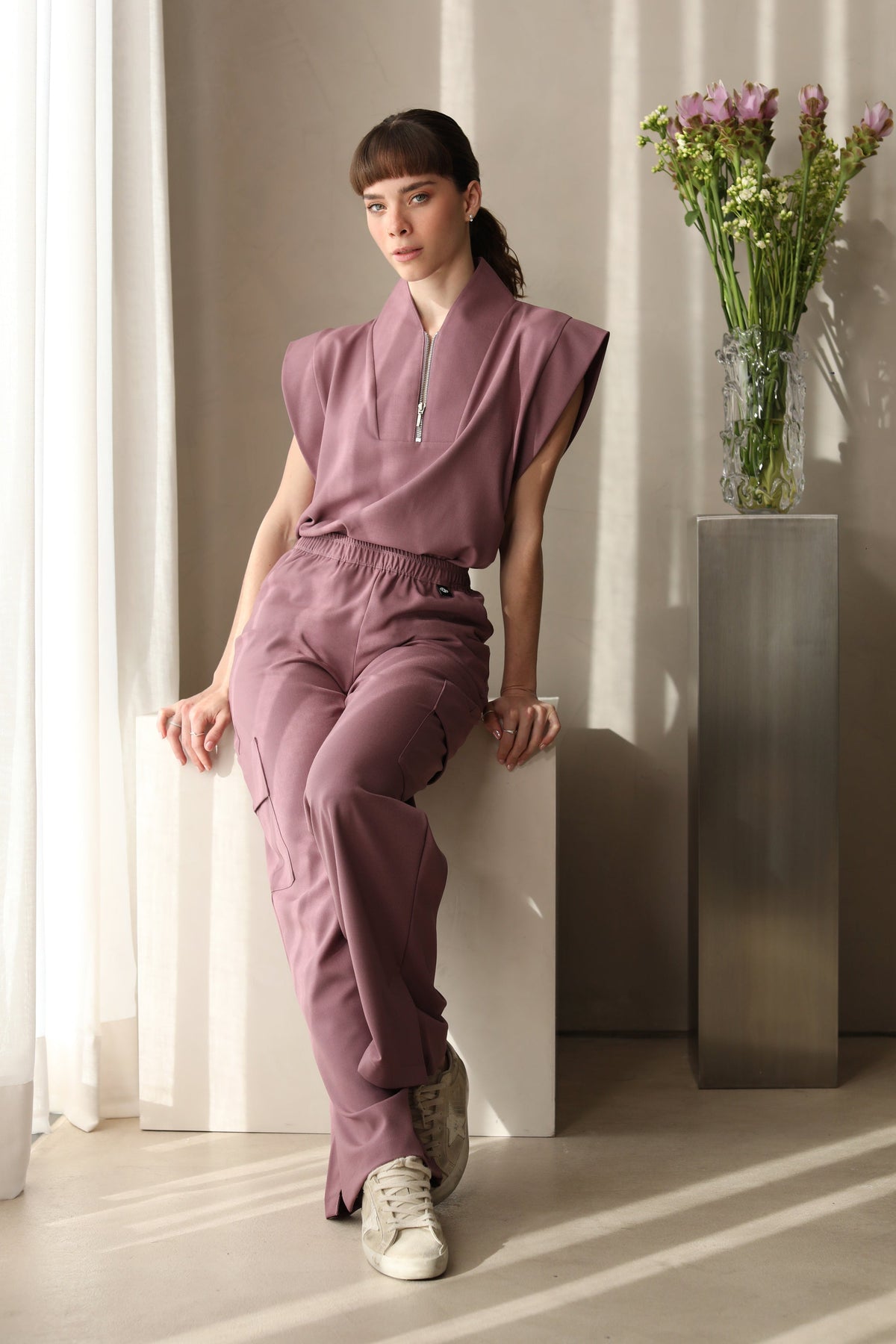 Full look of Kate Mauve Scrub Pants with matching scrub top