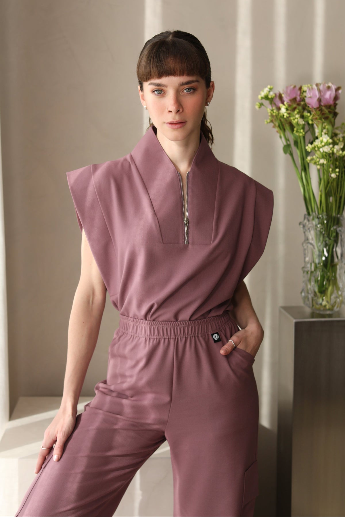 Full look of Kate Mauve Scrub Top with matching scrub pants