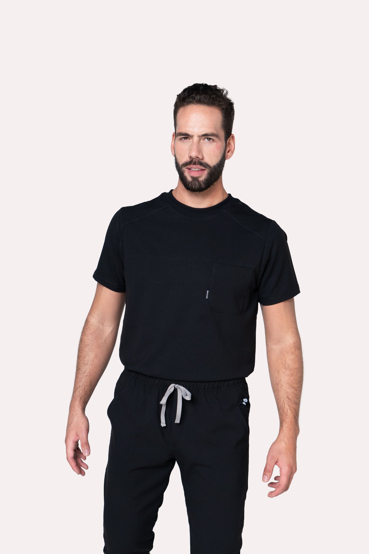 Front view of Sport Black Scrub Top showing the athletic fit and crew neckline