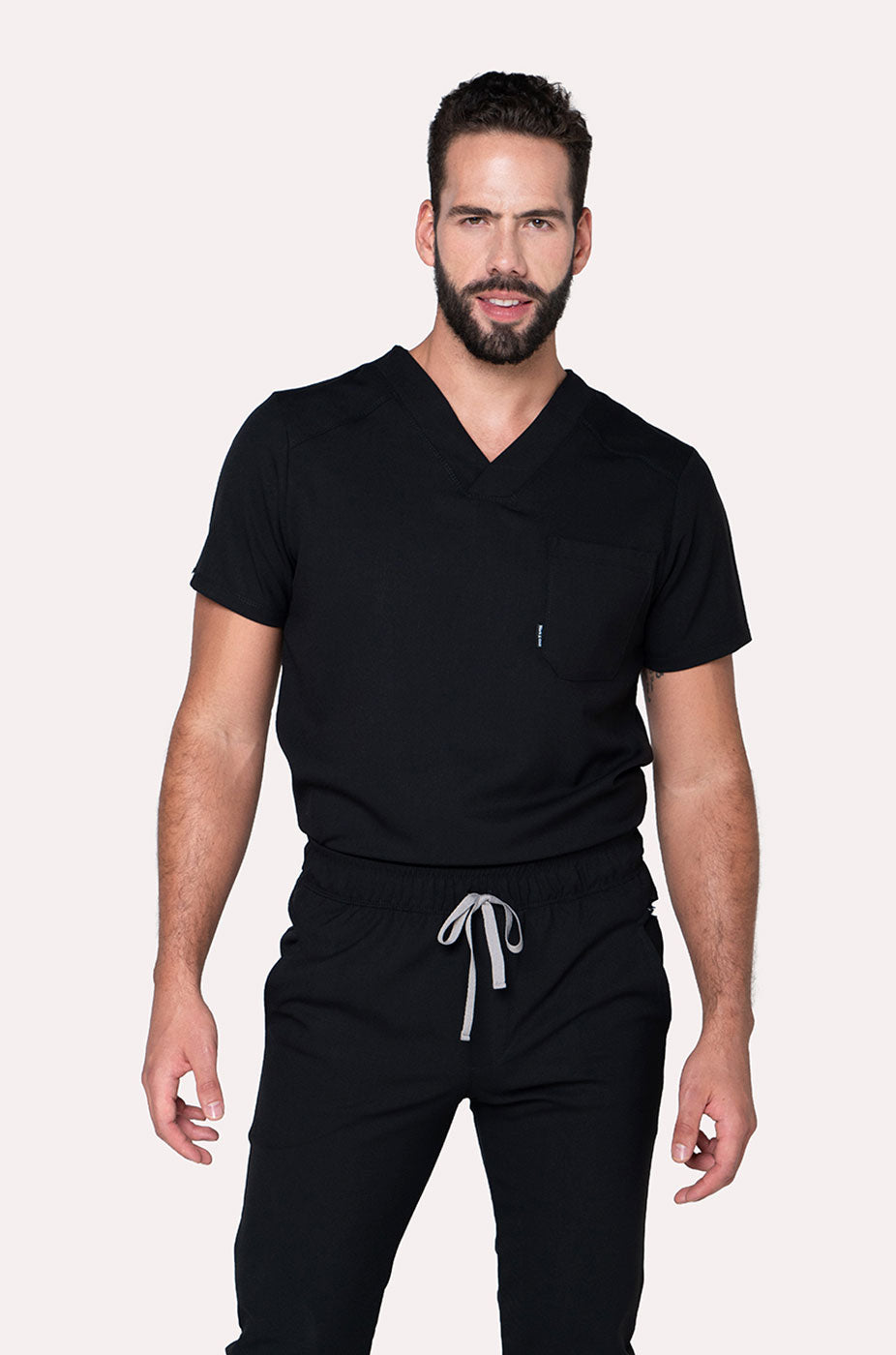 Man wearing Fresh Black Scrub Top by Work & Chill