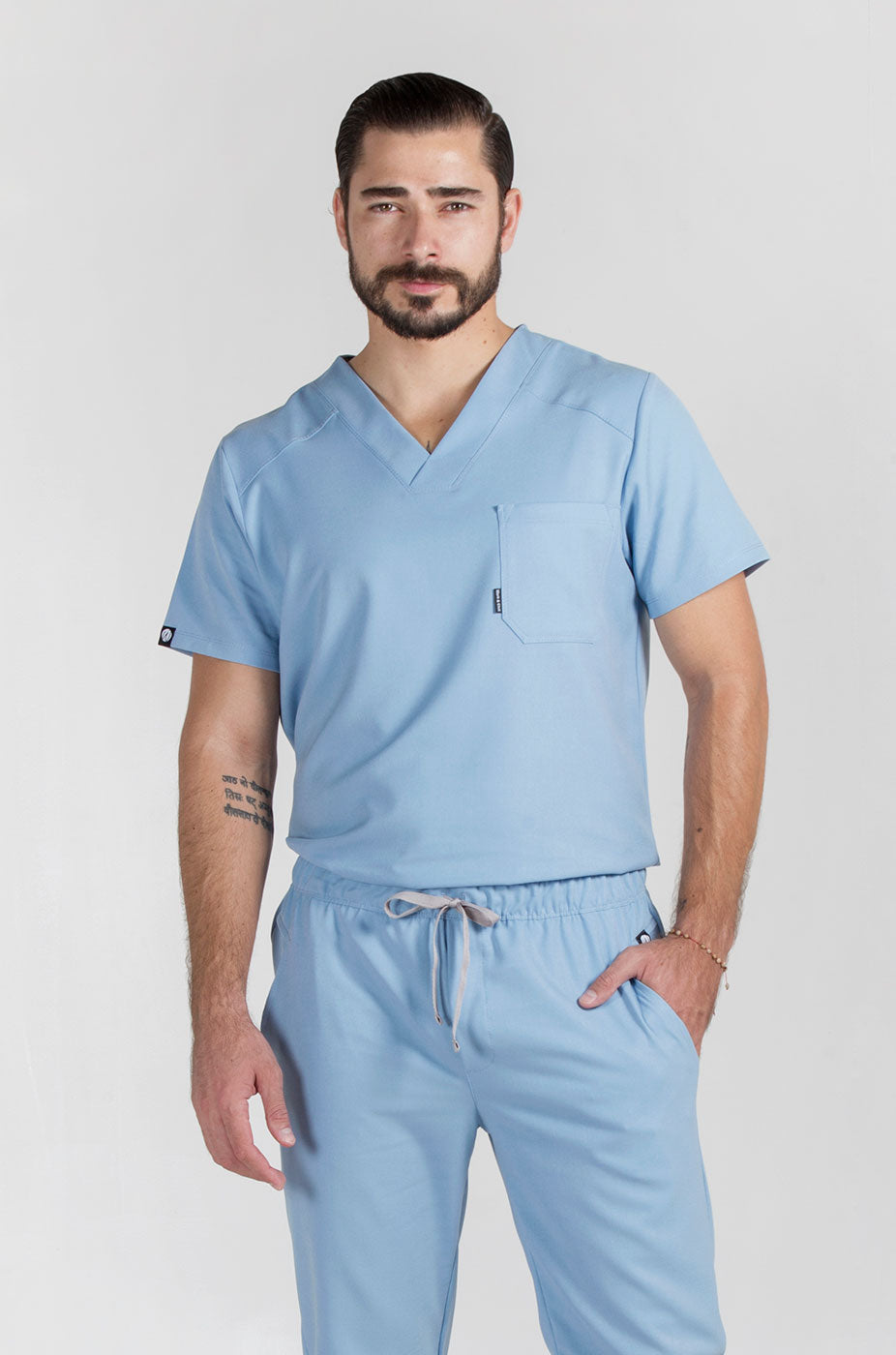 Man wearing Fresh Dream Blue Scrub Top by Work & Chill